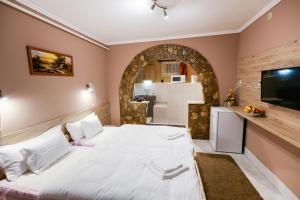 Posteľ alebo postele v izbe v ubytovaní Lara Apartman