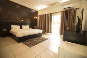 Voodi või voodid majutusasutuse Hotel Palm Beach toas