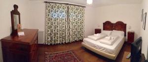 Postel nebo postele na pokoji v ubytování Agriturismo Scacciapensieri
