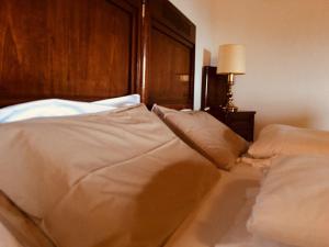 Postel nebo postele na pokoji v ubytování Agriturismo Scacciapensieri