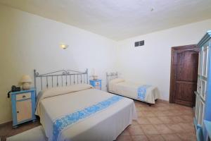 Postel nebo postele na pokoji v ubytování Hotel L'Esagono