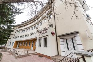 a building with a sign on the front of it at Семеен хотел Пауталия in Kyustendil