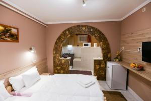 Posteľ alebo postele v izbe v ubytovaní Lara Apartman