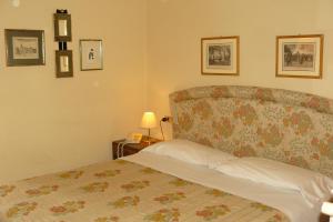 Postel nebo postele na pokoji v ubytování Hotel La Rocca