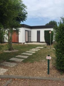 a house with a sign in front of it at Vakantiehuis Jonckershof in Middelkerke