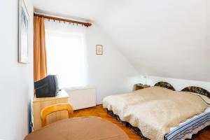 Postel nebo postele na pokoji v ubytování Burg Vendégház