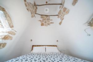 מיטה או מיטות בחדר ב-Villa Trullo