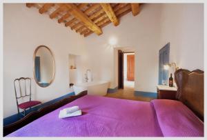 Postel nebo postele na pokoji v ubytování Agriturismo Rosso di Sera