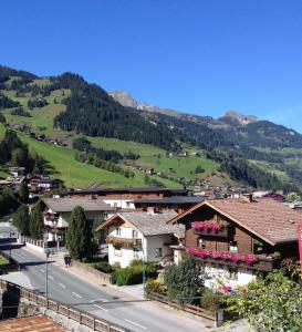 a village in the mountains with a road and houses at Gästehaus Anna in Grossarl