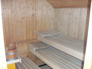 Palanda nebo palandy na pokoji v ubytování Gasthof Bischofsmühle