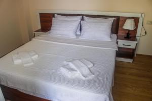 Postel nebo postele na pokoji v ubytování Golden Fleece Hotel