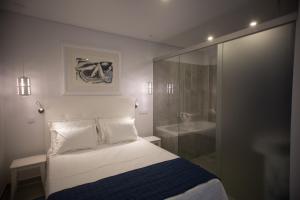En eller flere senge i et værelse på VILAPURA - Naturism