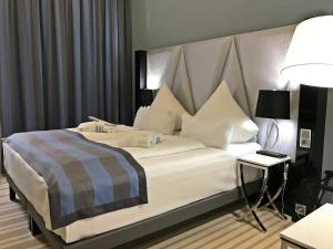 Postel nebo postele na pokoji v ubytování Mercure Hotel Kaiserhof City Center