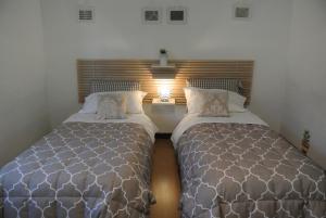 A bed or beds in a room at B&B Via Dei Templi