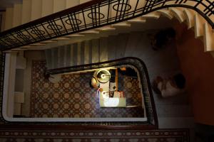 a view of a doll house through a mirror at Corner Hostel in Sliema