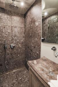 a bathroom with a shower and a sink at Ferienwohnung Sönshorn 16 in Munkmarsch +16 photos