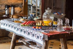 a table full of food on top of a table at Pousada Vila Mineira in Lavras Novas