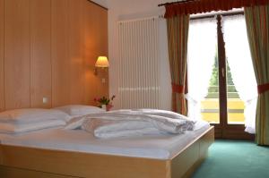 Postel nebo postele na pokoji v ubytování Hotel Brandl