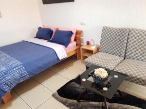 Postel nebo postele na pokoji v ubytování Residence Fatiny