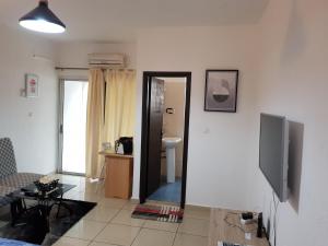TV a/nebo společenská místnost v ubytování Residence Fatiny