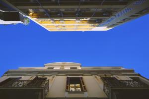 a view of the top of a building with a blue sky at Central Apartments in Psiri in Athens