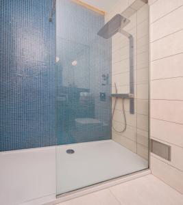 a shower with a glass door in a bathroom at Apartments Blue Maris Žnjan in Split +31 photos