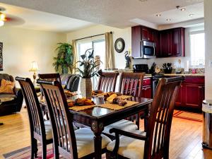a kitchen and dining room with a table and chairs at West Coast Vista 3E Bay View Condo 442 in Clearwater Beach