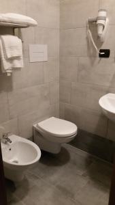Koupelna v ubytování Ricci Rooms
