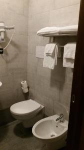Koupelna v ubytování Ricci Rooms