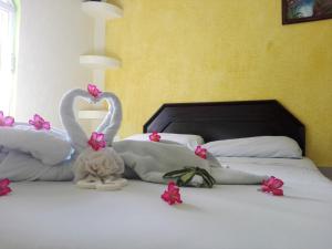 Postel nebo postele na pokoji v ubytování Hotel Melina