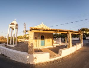 a small building on the side of a street at Vagia Beach Apartments in Vaia