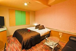 เตียงในห้องที่ Hotel Joy (Love Hotel)