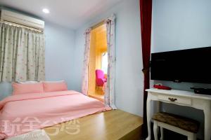 TV a/nebo společenská místnost v ubytování Shuanghu Garden B&B