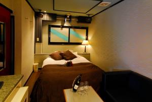 Una cama o camas en una habitación de Hotel Joyseaside (Love Hotel)