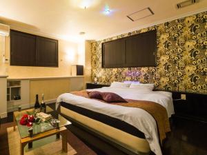 Ένα ή περισσότερα κρεβάτια σε δωμάτιο στο Hotel TiAMO (Love Hotel) +14 φωτογραφίες