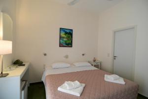 Ένα ή περισσότερα κρεβάτια σε δωμάτιο στο Βίλα Άνεσις