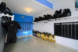 a room with a bunch of skis on a wall at Amed Harmony Bungalows And Villas in Amed