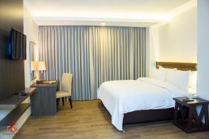 TV a/nebo společenská místnost v ubytování Hotel Marciano