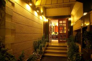 a hallway of a building with stairs and lights at Ahuja Residency Cyber City II in Gurgaon