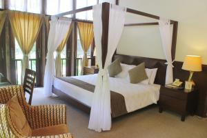 Giường trong phòng chung tại Gardenia Resort and Spa