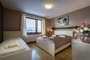 Postel nebo postele na pokoji v ubytování Apartments Sofia