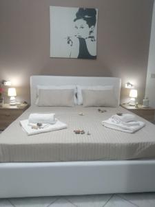 Ένα ή περισσότερα κρεβάτια σε δωμάτιο στο Perla Del Mare Affittacamere