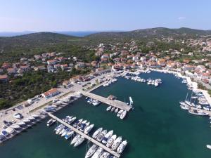 an aerial view of a marina with boats in the water at Apartments Lavanda - free parking and grill in Jezera