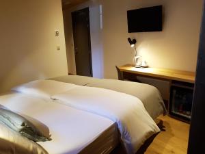 Postel nebo postele na pokoji v ubytování Hotel Vandot