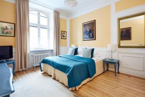 a bedroom with a bed and a television in it at Hotel Hornsgatan in Stockholm