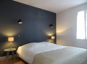 מיטה או מיטות בחדר ב-Maison Bel-Air