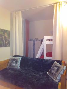 Ένα ή περισσότερα κρεβάτια σε δωμάτιο στο Appartement à la montagne