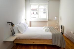 Liiiving in Porto | Santa Catarina Luxury Apartmentsにあるベッド