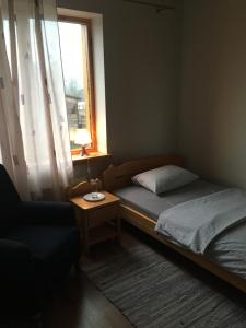 Postel nebo postele na pokoji v ubytování Dzirnaviņas