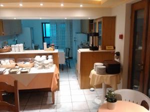 A kitchen or kitchenette at Vlachogiannis Hotel